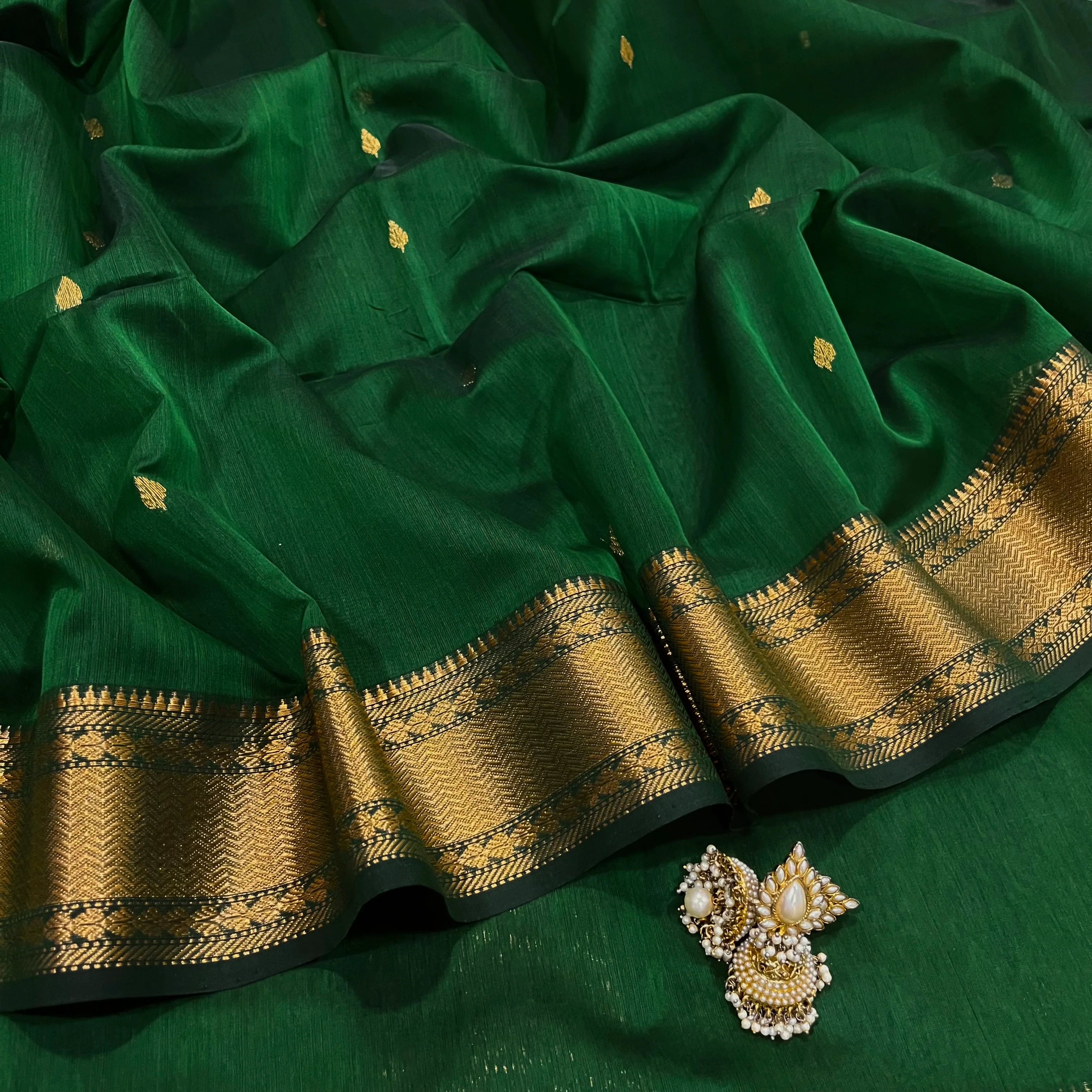 Bottle green Maheshwari saree with zari bootis and zari border
