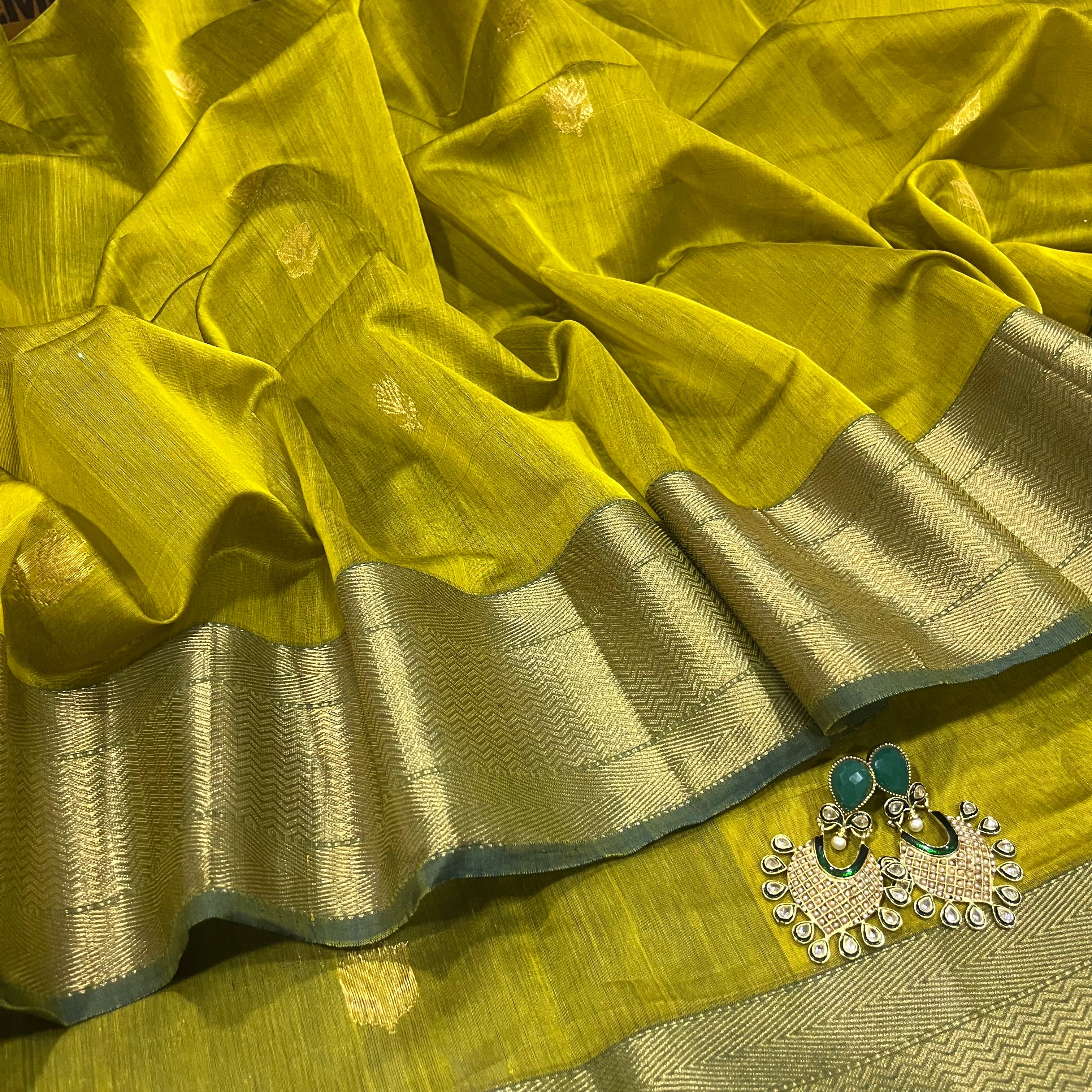Mustard and green Maheshwari saree with flower motifs all over