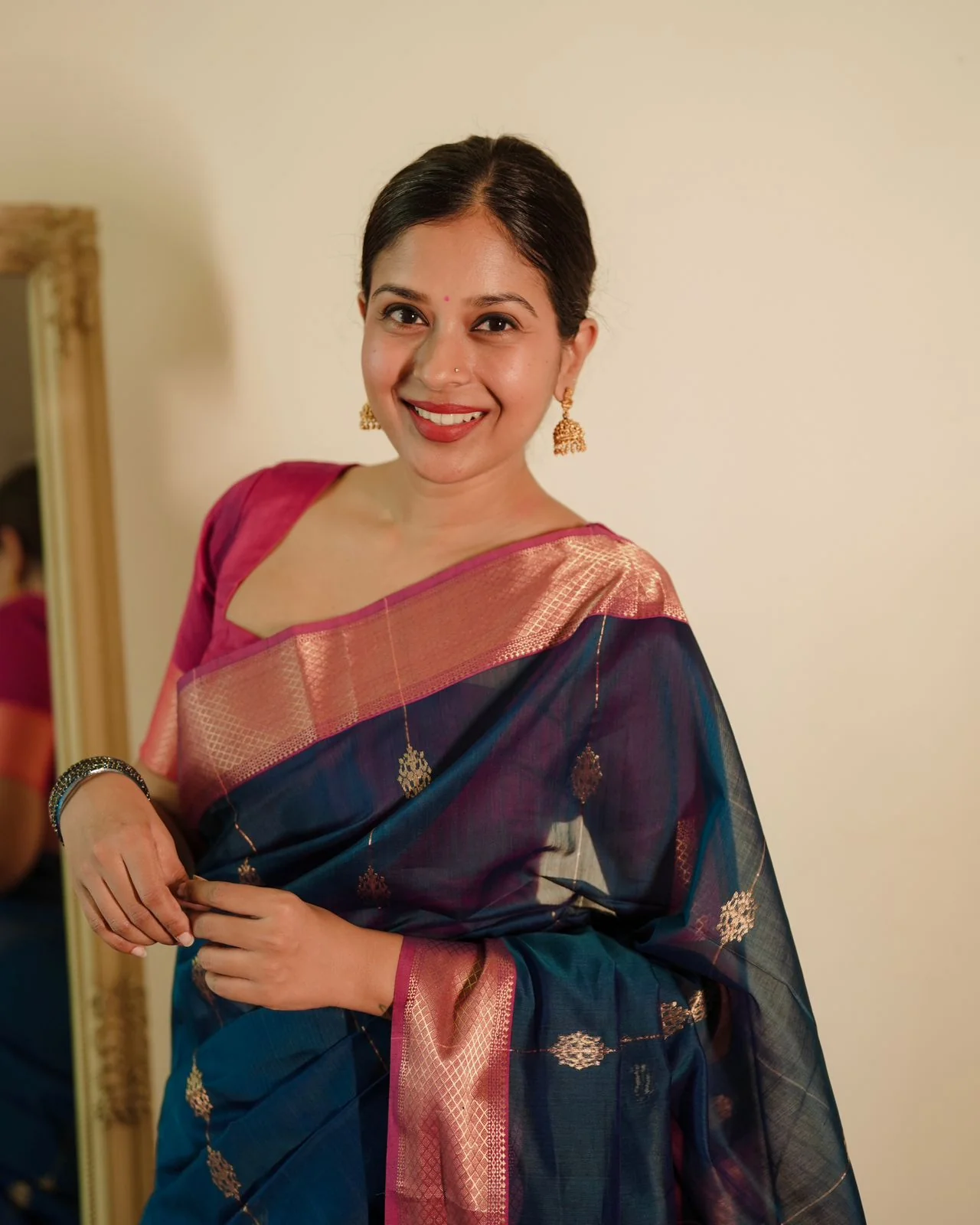Peacock blue and pink Maheshwari saree with zari motifs all over